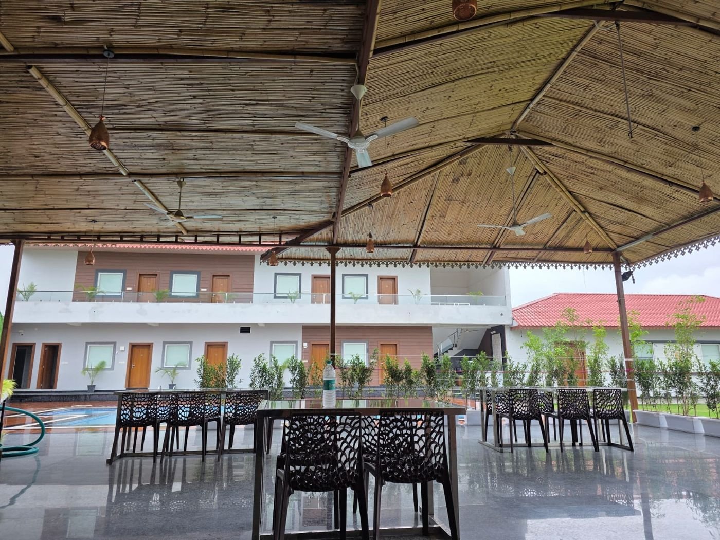 Gazebo dining tables beside the pool at The Ambay Villa Udaipur