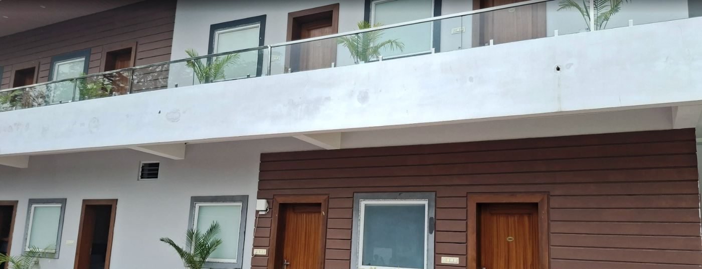 Room doors and shared first-floor balcony at The Ambay Villa Udaipur